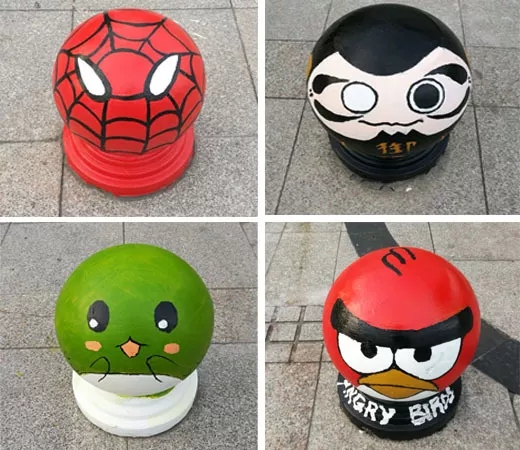 为市民广场科技馆,博物馆,图书馆门前及周边的单调隔离墩,窨井盖涂鸦